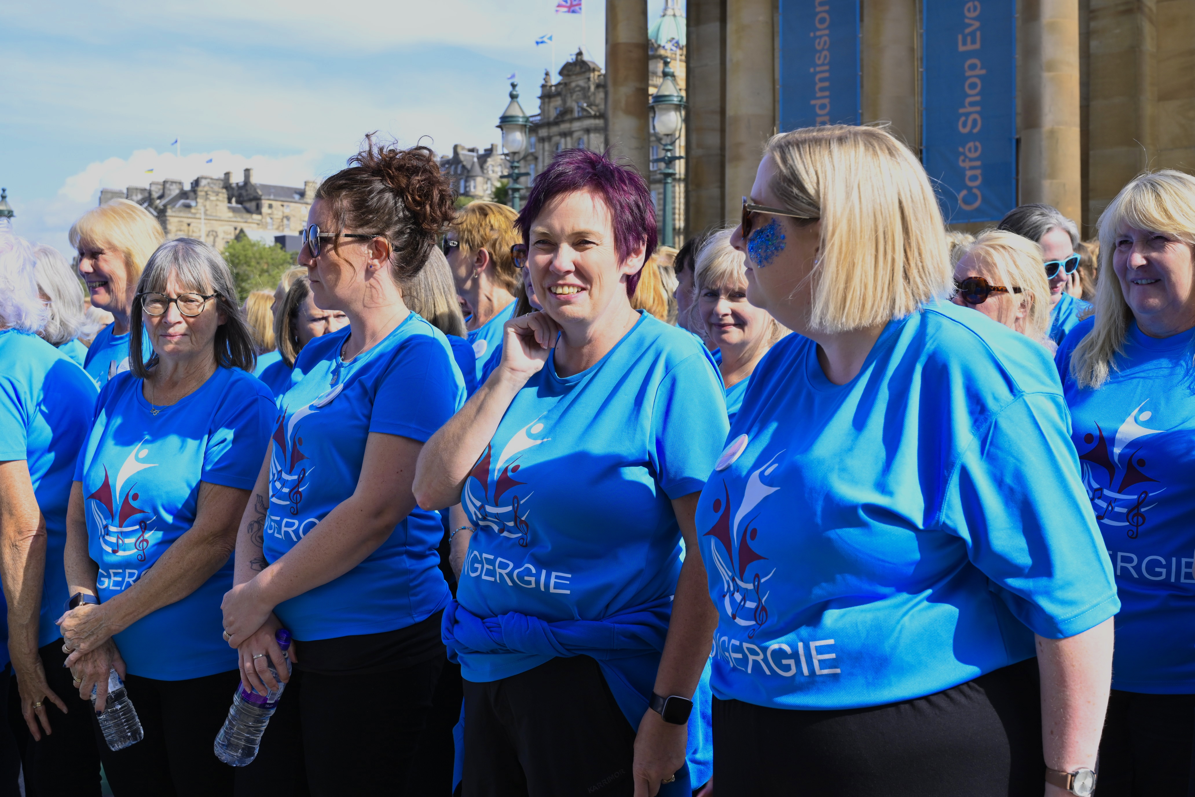 A group of Singergie members preparing to perform